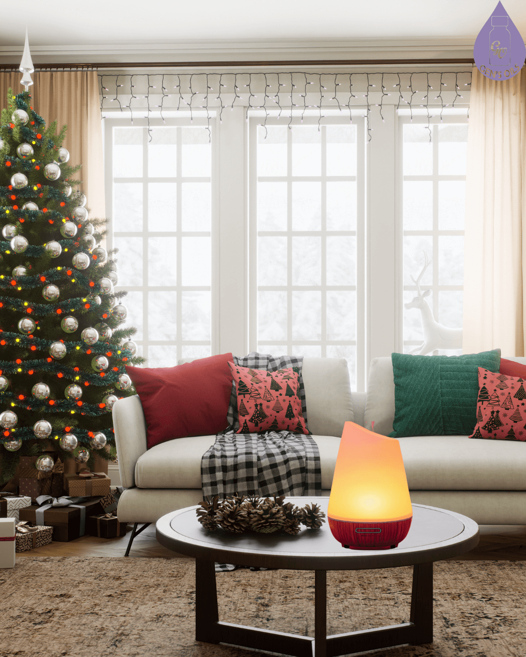 Christmas Tree in the corner of a living room, with pinecones & a diffuser glowing on a coffee table in front of a couch.