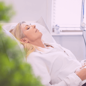 cupuncturist Deanna Thomas treating a patient's elbow at her Middlesbrough clinic to relieve chronic pain and tension.