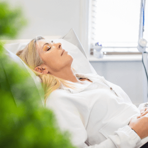 Client resting comfortably during a calm one-to-one NADA ear acupuncture session in a Middlesbrough wellbeing clinic
